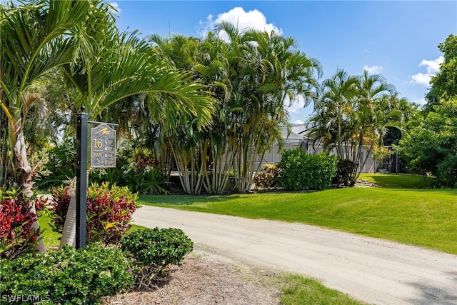 view of home's community featuring a yard