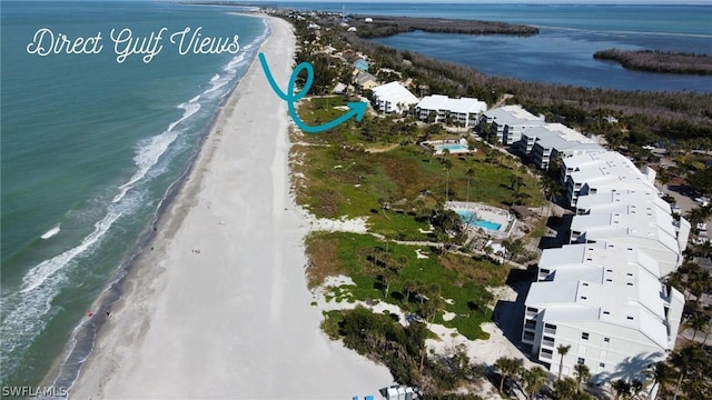 aerial view featuring a water view and a beach view