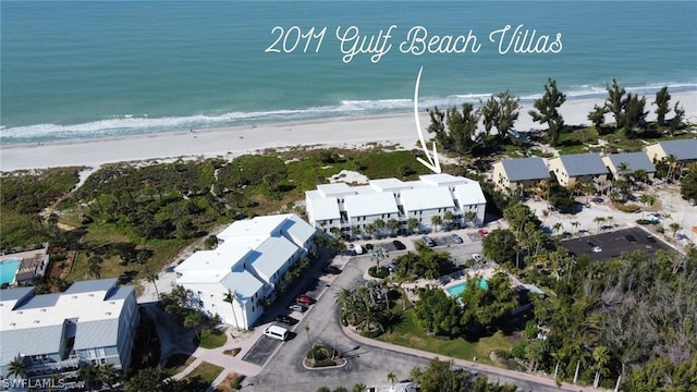 aerial view featuring a water view and a view of the beach