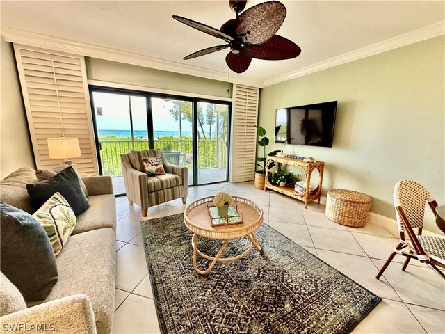 tiled living room featuring ornamental molding and ceiling fan