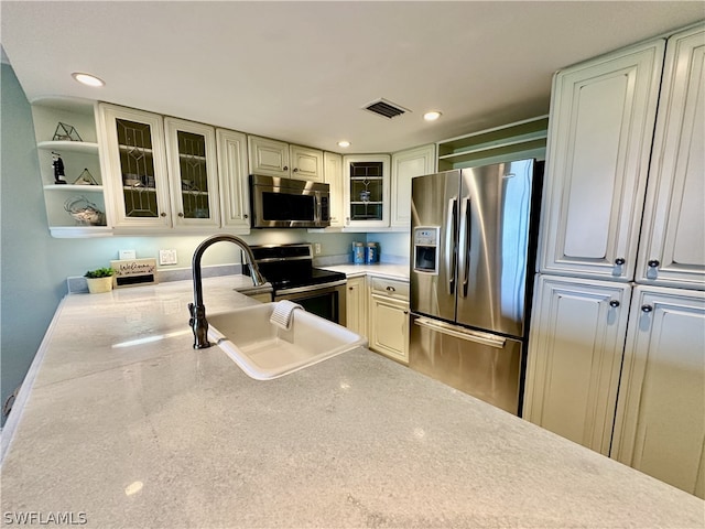 kitchen featuring appliances with stainless steel finishes and sink