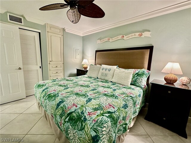 bedroom with crown molding, light tile patterned floors, and ceiling fan