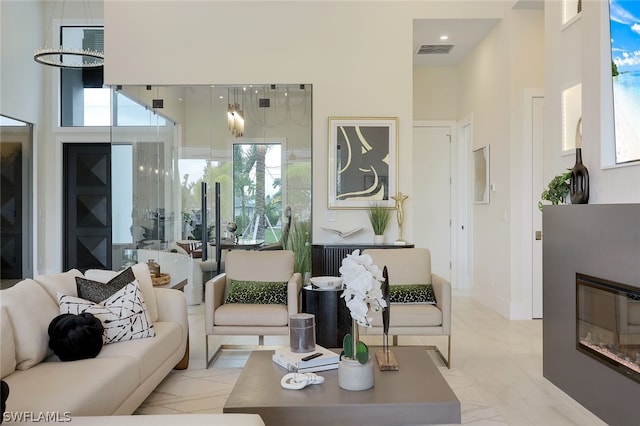 living room with a high ceiling