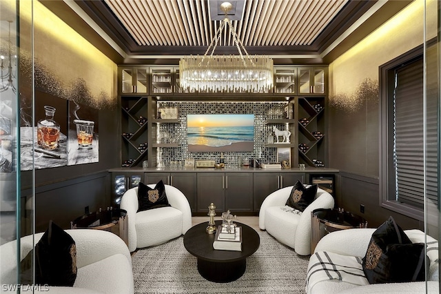 bar with a raised ceiling and ornamental molding