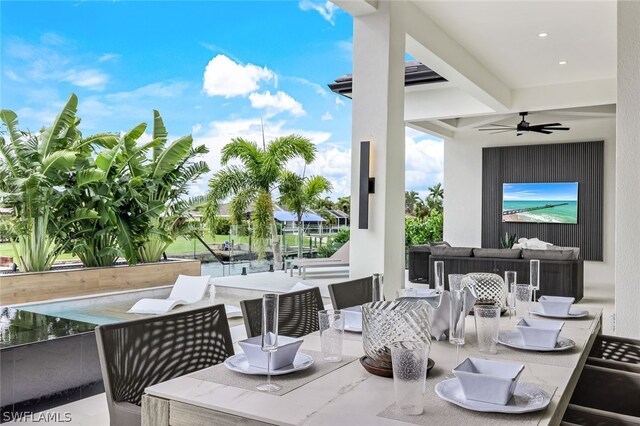 view of patio / terrace with outdoor dining area, ceiling fan, and an outdoor hangout area