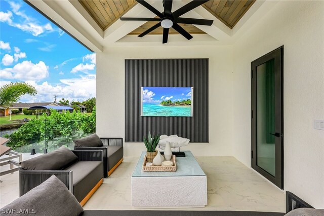 view of patio with an outdoor living space and ceiling fan