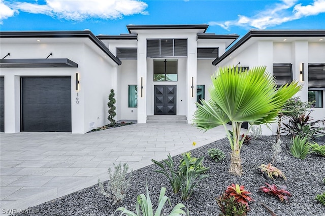 view of exterior entry with a garage