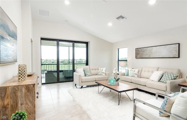 tiled living room with lofted ceiling