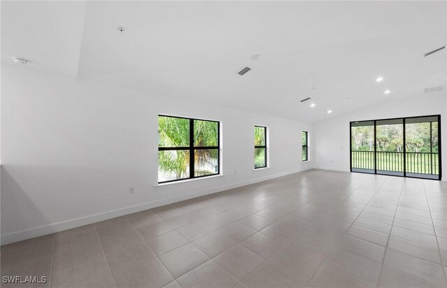 empty room with light tile patterned flooring, baseboards, visible vents, and recessed lighting