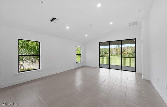 empty room with light tile patterned flooring, visible vents, and recessed lighting