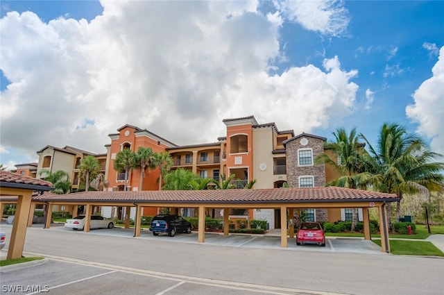 view of property featuring covered parking