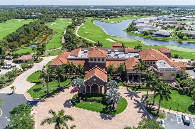 birds eye view of property featuring golf course view and a water view