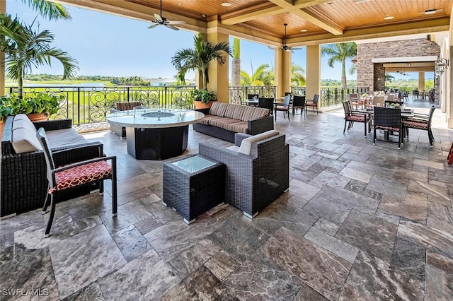 view of patio / terrace featuring a ceiling fan, outdoor dining area, and an outdoor living space