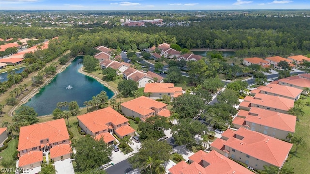 birds eye view of property featuring a water view and a residential view