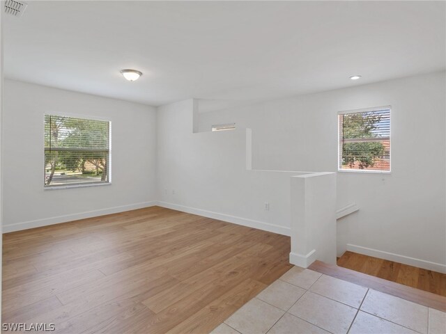 spare room with light wood-type flooring