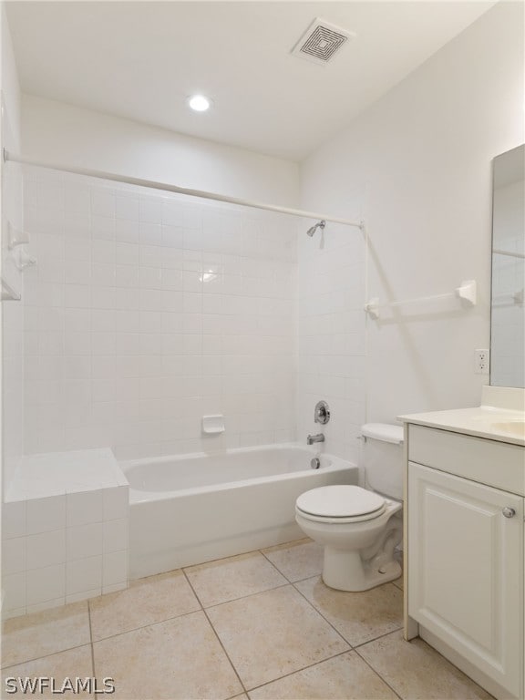 full bathroom with visible vents, toilet, tile patterned floors, vanity, and washtub / shower combination