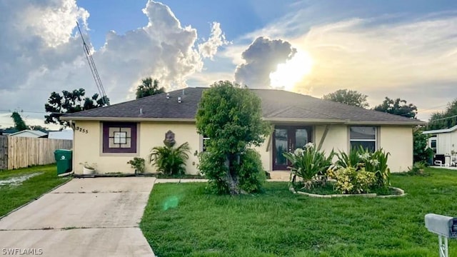 view of front of home with a lawn