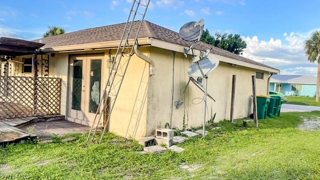 rear view of house with a yard