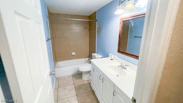 full bathroom featuring toilet, vanity, tiled shower / bath, and tile patterned flooring