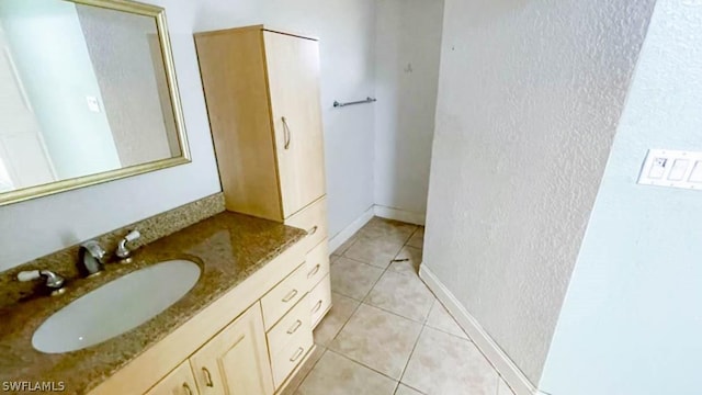 bathroom with vanity and tile patterned flooring