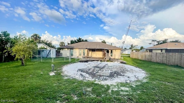 rear view of house with a yard