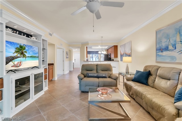 tiled living room with built in shelves, crown molding, and ceiling fan