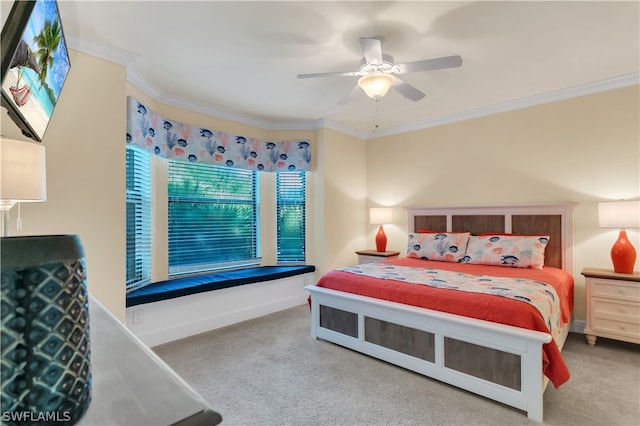 carpeted bedroom with crown molding and ceiling fan