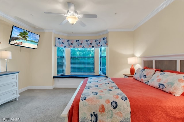 carpeted bedroom with ceiling fan and crown molding