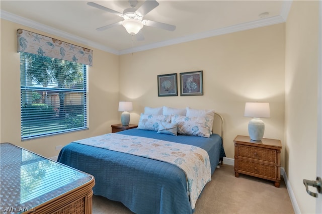 bedroom with carpet, ceiling fan, and ornamental molding