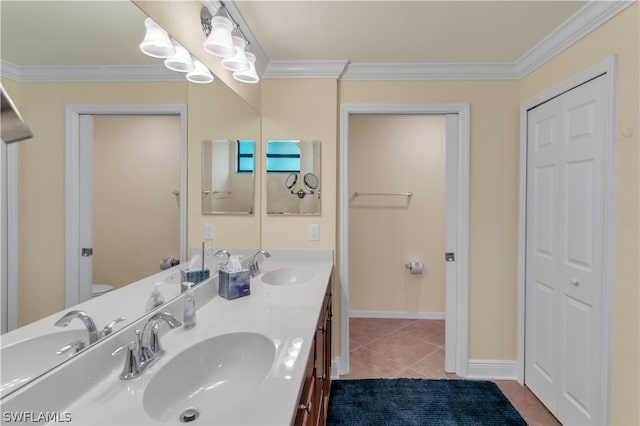 bathroom with ornamental molding, tile patterned floors, and double sink vanity