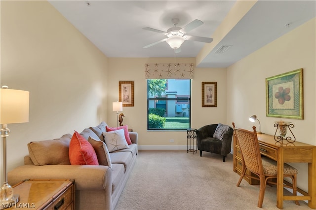 carpeted living room with ceiling fan