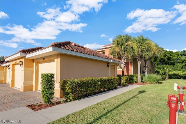 view of side of home featuring a lawn