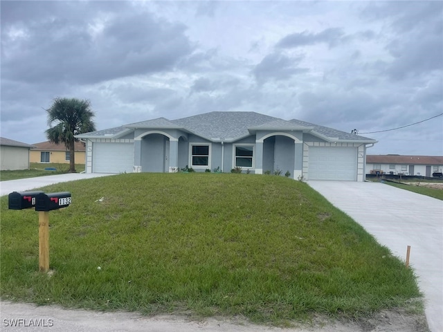 1132/1134 Harold Ave S, Lehigh Acres, FL 33973 - ranch-style house with driveway, a front yard, and a garage