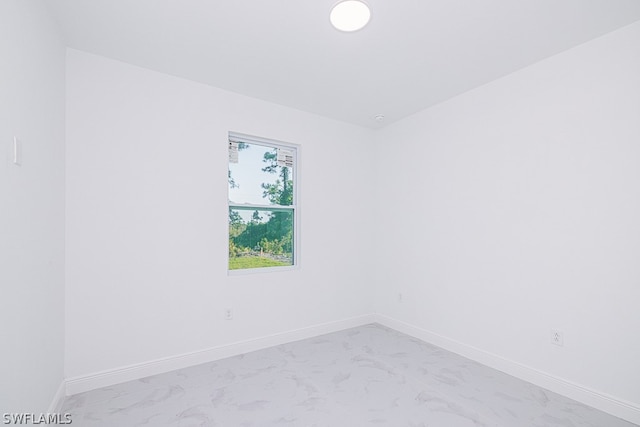 empty room featuring light tile patterned flooring