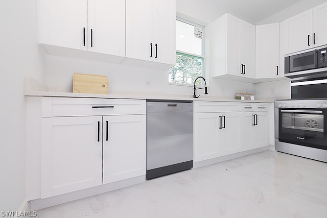 kitchen with stove, dishwasher, stainless steel microwave, and white cabinetry