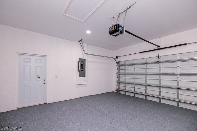 garage featuring electric panel and a garage door opener