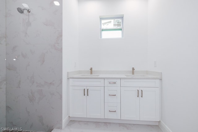 bathroom with tile patterned floors and dual sinks