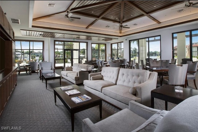 sunroom / solarium with coffered ceiling and ceiling fan