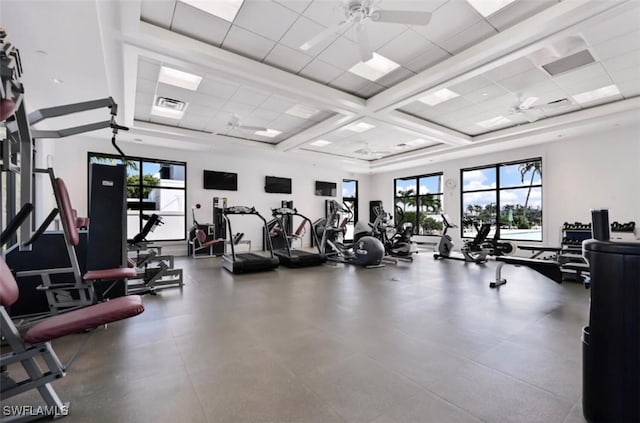 workout area featuring a drop ceiling and ceiling fan