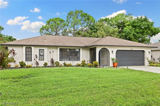 single story home with a garage and a front lawn