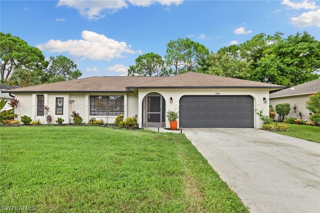 ranch-style house with a garage and a front lawn