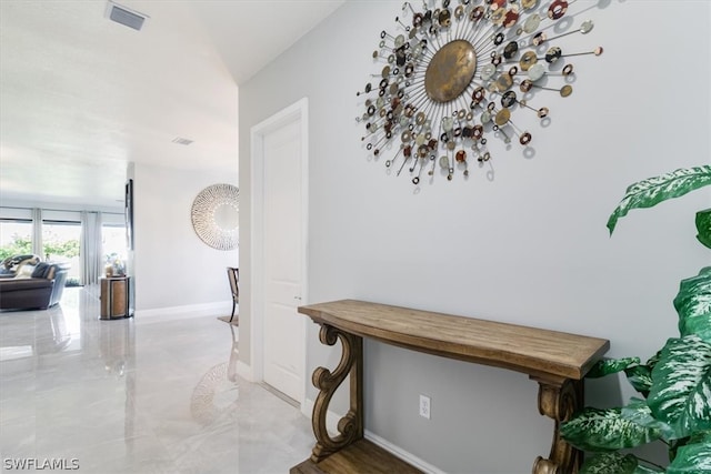 hallway with tile patterned floors