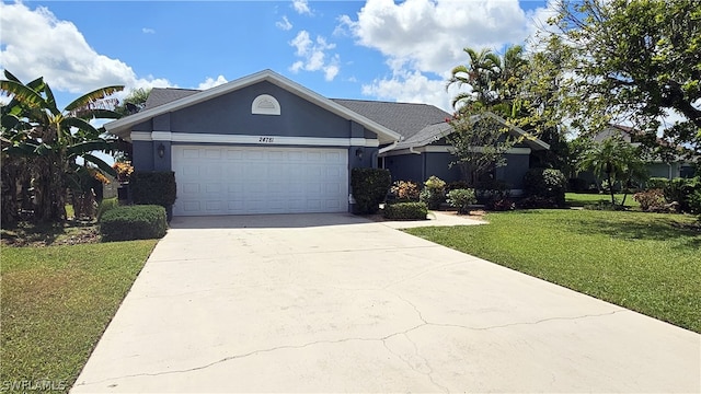 single story home with a garage and a front lawn