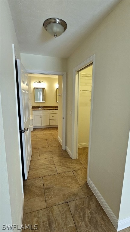 hallway with light tile patterned floors