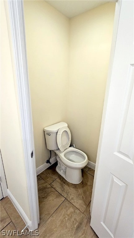 bathroom with tile patterned flooring and toilet