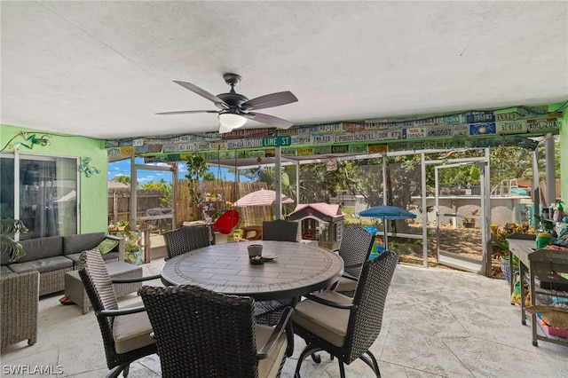 sunroom featuring ceiling fan