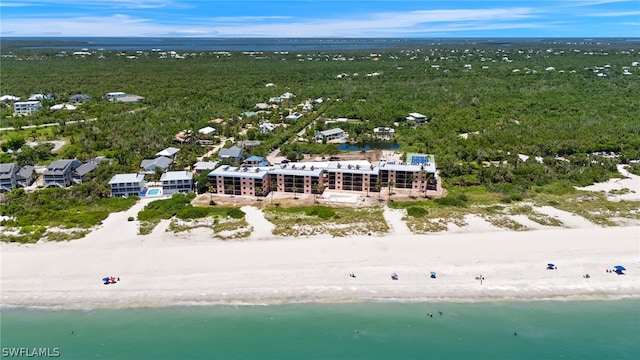 bird's eye view with a water view and a beach view