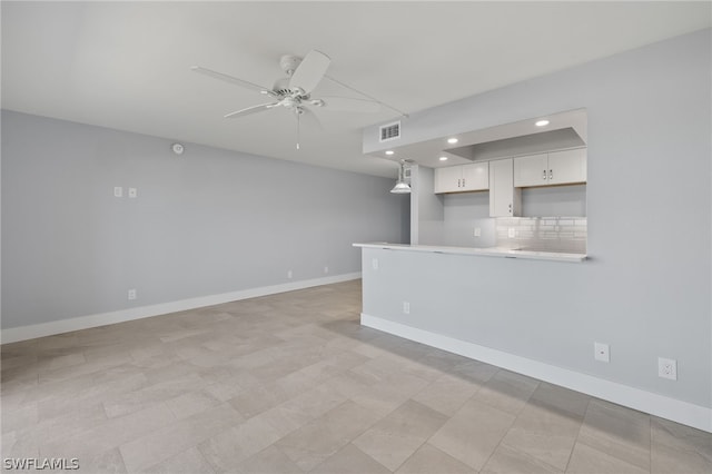 unfurnished living room with ceiling fan