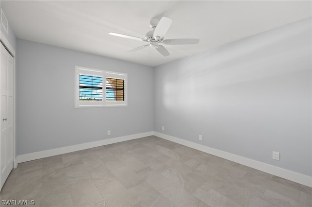 empty room featuring ceiling fan