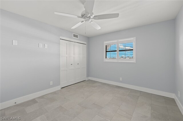 unfurnished bedroom featuring a closet and ceiling fan